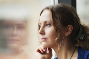 girl looking out the window119638914